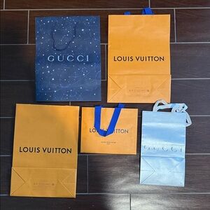 Gucci and Louis Vuitton bags